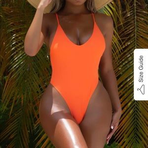 MATTE Collection small orange 1 piece with cross  back. Straps are adjustable.